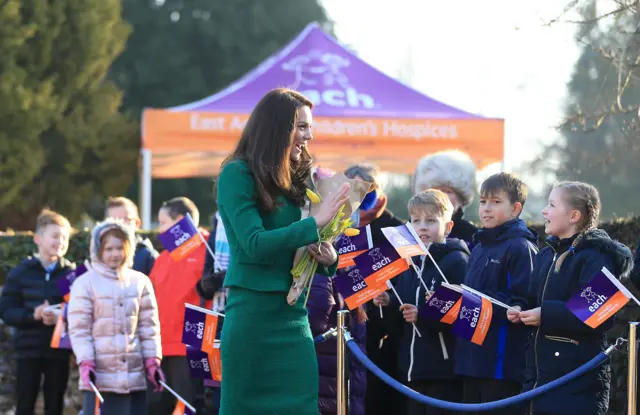 The Duchess of Cambridge smiling at schoolchildren