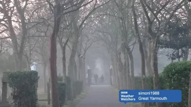 Misty walk through with graveyard to one side