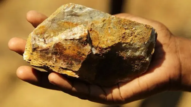 Person holding rock