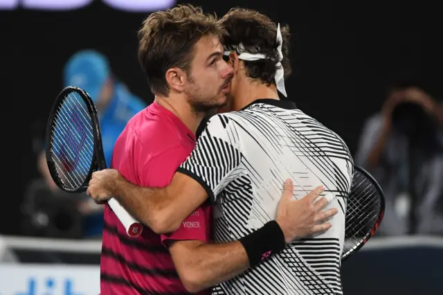 Stan Wawrinka and Roger Federer embrace after their match