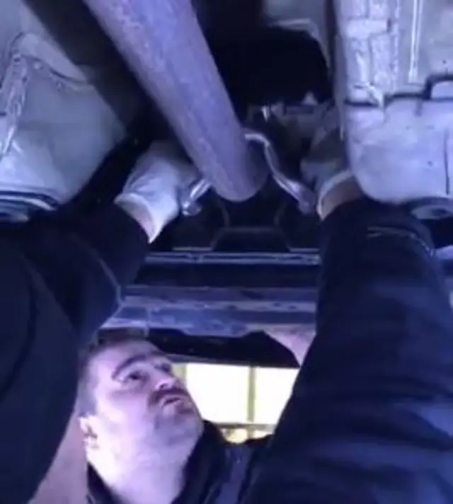 Mechanics trying to reach the cat