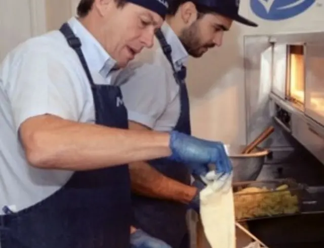 Fish going into fryer