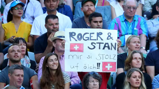 A fan with a sign supporting the players