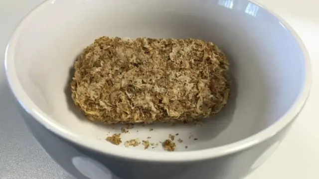 A Weetbix biscuit in a bowl