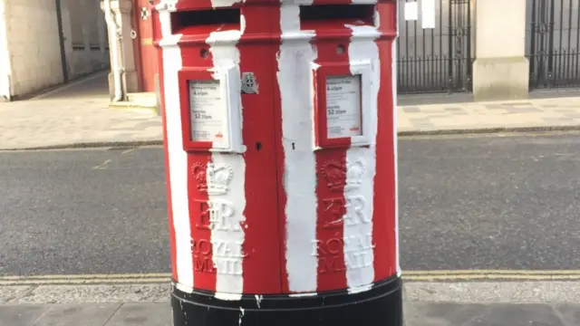 A post box painted in Southampton colours