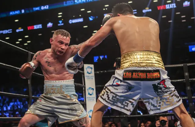 Carl Frampton throws a jab to Leo Santa Cruz's forehead