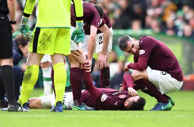 Hearts defender John Souttar lies injured at Celtic Park