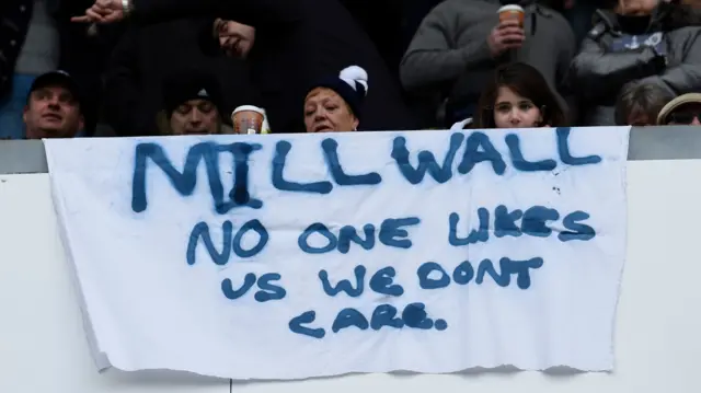 A banner says no one likes us we don't care