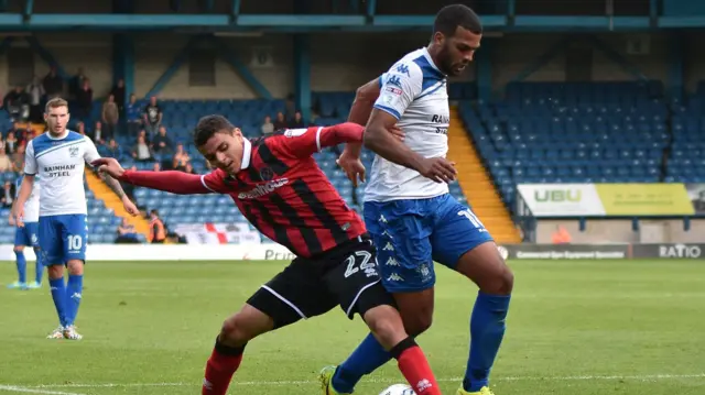 Moha El Ouriachi Choulay tackles Bury's Jacob Mellis while with Shrewsbury Town