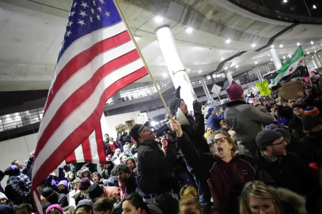 Demonstrators protest agaist President Trump"s executive immigration ban at Chicago O"Hare International Airport o