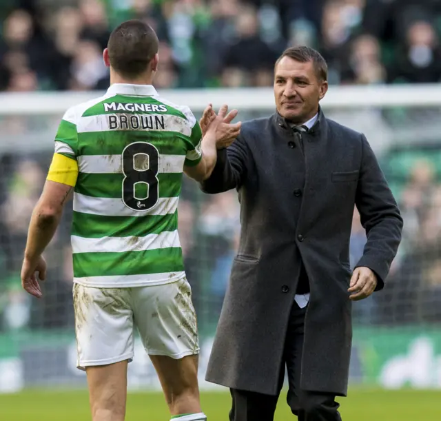 Celtic manager Brendan Rodgers celebrates with captain Scott Brown at full-time