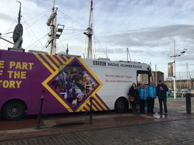 Stef Galbraith, Culture volunters and Phil White standing by the BBC Bus