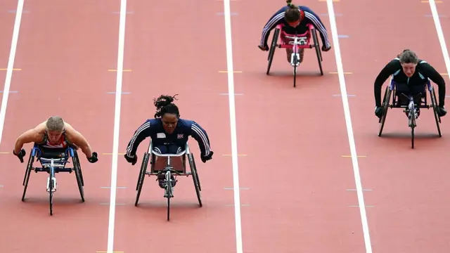 Anne Wafula-Strike races with Hannah Cockroft of GV in Women's 100m T54 final in London 2012 Paralympic Games