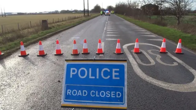 Police road closed sign