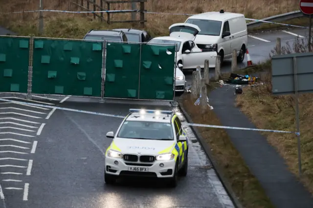 Discarded medical equipment at the roadside at the scene near junction J24 of the M62