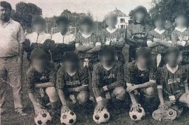 Ted Langford (pictured left) with a young boys team with their faces blurred