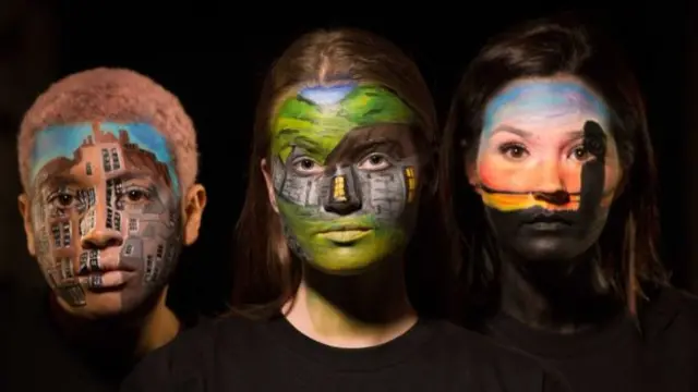 Models' faces painted with some of Scotland world heritage sites