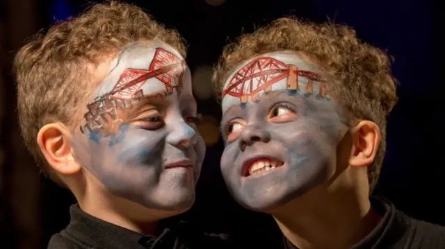 Two children with Forth Road Bridge painted on their faces