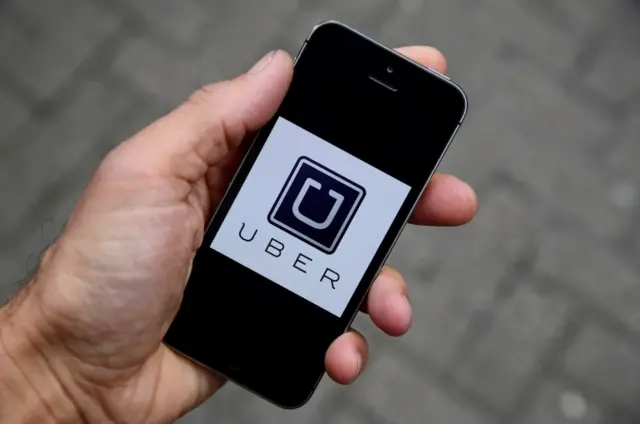 Uber logo on mobile phone