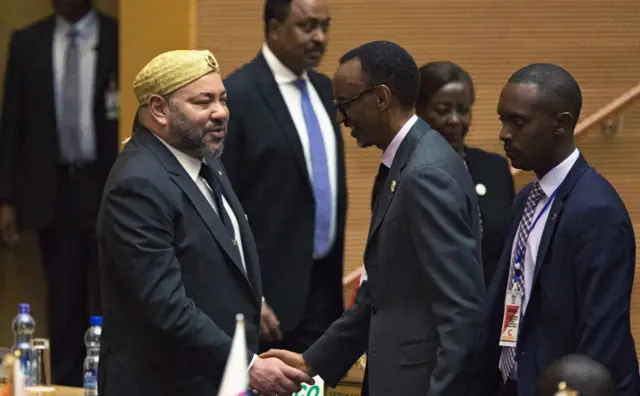 King of Morocco Mohammed VI (L) greets Rwanda"s President Paul Kagame in the main plenary of the African Union in Addis Ababa on Jan 31, 2017.