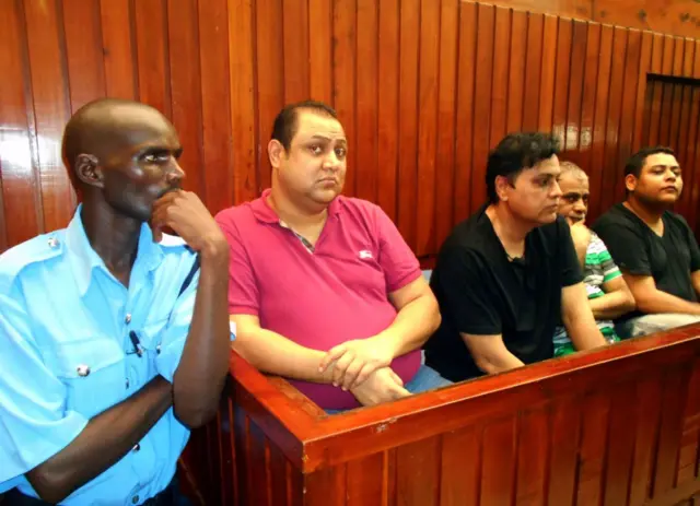 Four suspected top drug traffickers, Baktash Akasha Abdalla (2nd L), Vijaygiri Anandgiri (3rd L), Gulam Hussein (2nd R) and Ibrahim Akasha Abdalla (R) sit on February 9, 2015 in Mombasa Law Courts