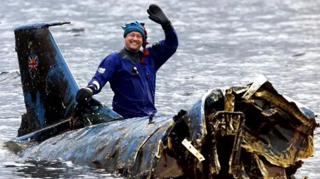 Bill Smith, on top of the wreck of Bluebird