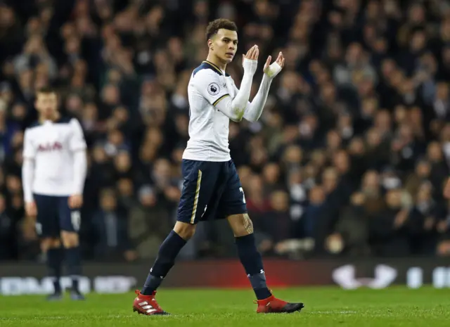 Dele Alli applauds the crowd