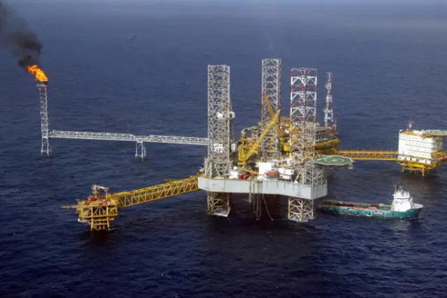 View of a Total Nigeria offshore oil and gas production platform at Amenam in the Niger delta 18 May 2005.