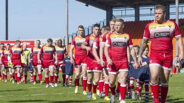 Sheffield Eagles players walking onto the field