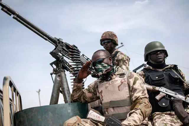 Soldiers from the 7th Division of the Nigerian Army on the back of a vehicle in Damboa, Borno State northeast Nigeria on March 25, 2016.