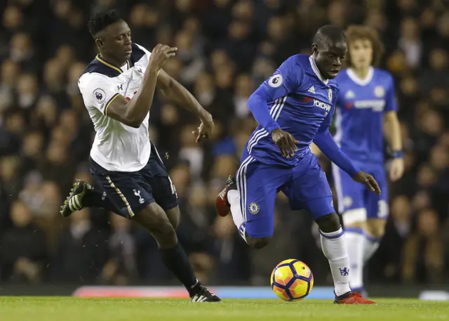 Victor Wanyama vies for the ball with N'Golo Kante