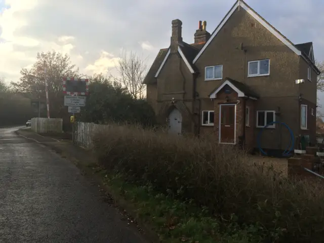 House by level crossing