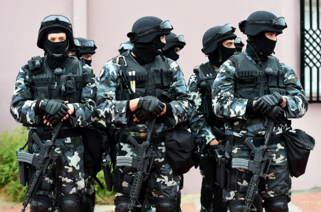 Tunisian soldiers stand guard