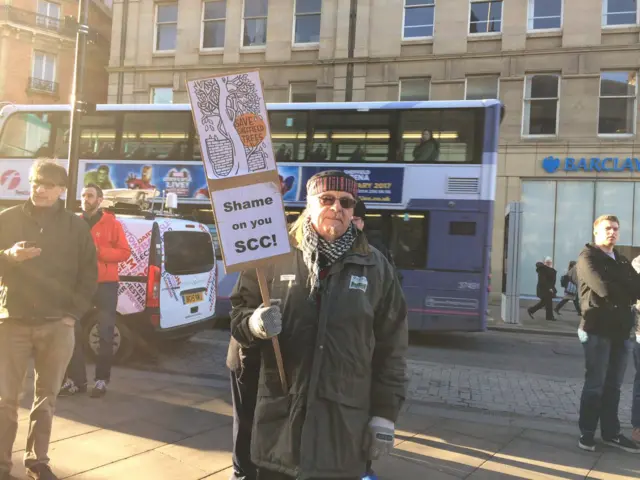 Protestor outside Leeds Town Hall