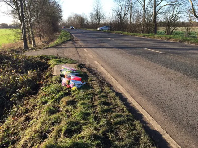 Floral tributes by roadside