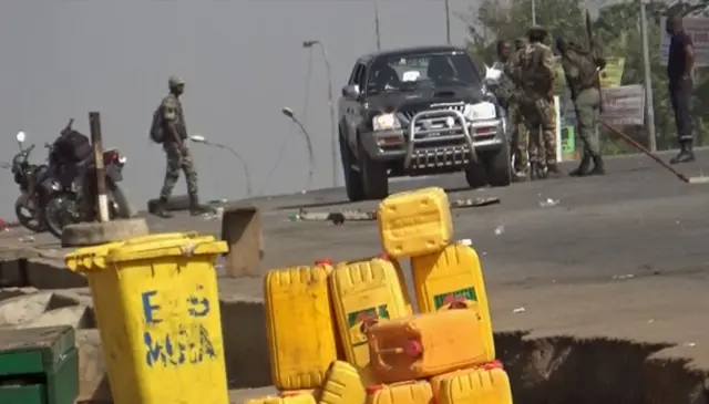 video of soldiers who have taken control of Bouake standing at a checkpoint in Bouake