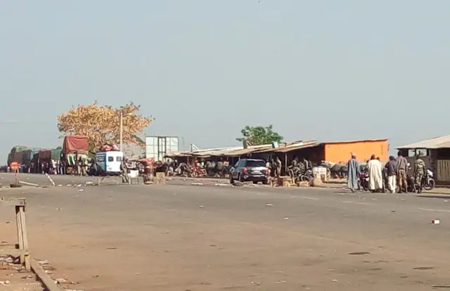 People walk in a street of Bouake on January 6, 2017.