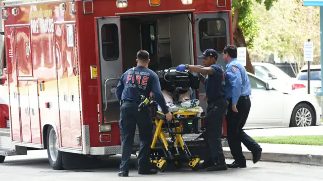 A shooting victim is unloaded from an emergency vehicle and taken into Broward Health Trauma Center in Fort Lauderdale, Florida