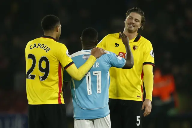 Watford"s Etienne Capoue and Sebastian Prodl with Burton Albion"s Lloyd Dyer after the match