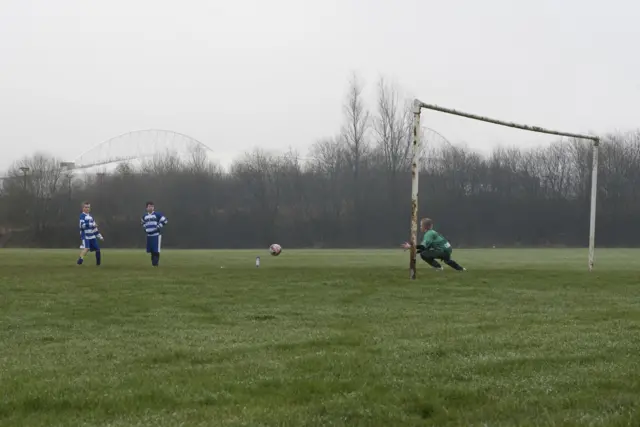 Young footballers play close to the DW Stadium