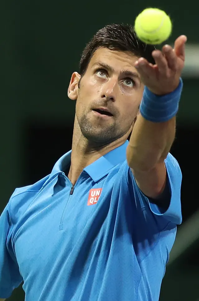 Novak Djokovic serves