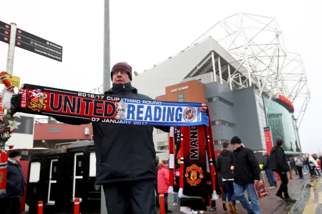 A man with a man utd v reading scarf