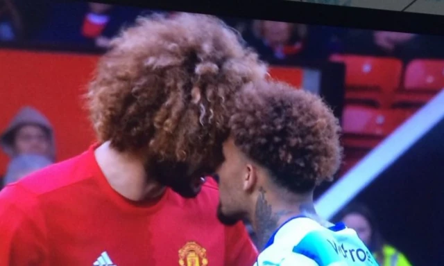 fellaini and williams go head to head with wild hairstyles