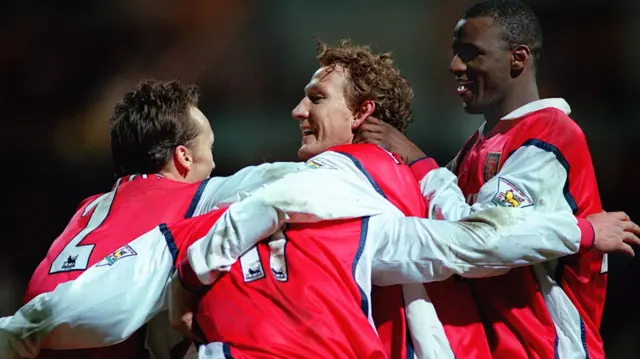 Arsenal celebrate at Deepdale