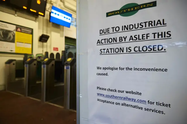 A sign warning of strike action at a station