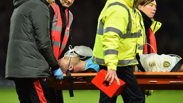 Burton Albion's English striker Luke Varney is taken off on a stretcher