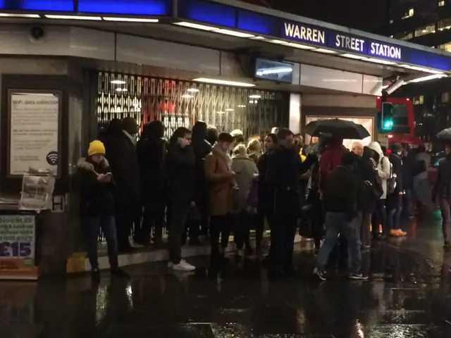 Commuters outside Warren Street Station