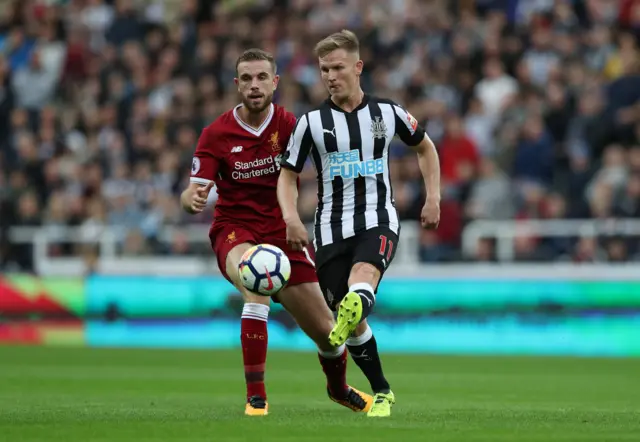 Newcastle's Matt Richie holds the ball