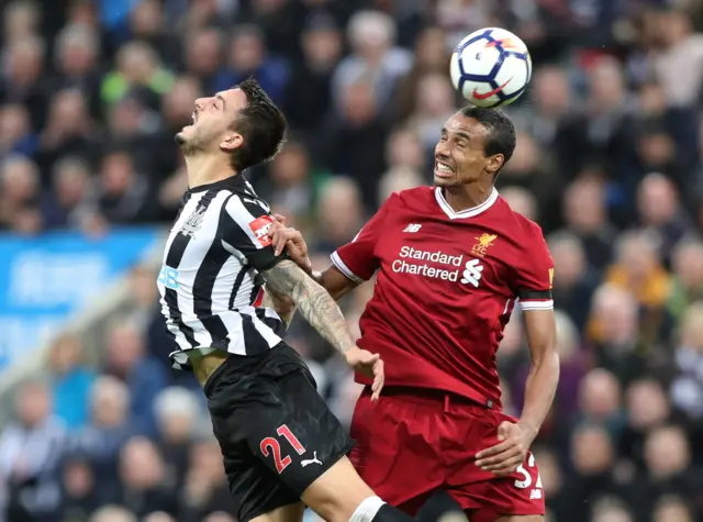 Newcastle's Joselu in action with Liverpool's Matip