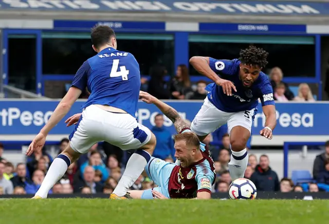 Scott Arfield goes down in the box